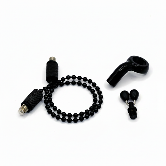 Black fishing tackle components on fully white background